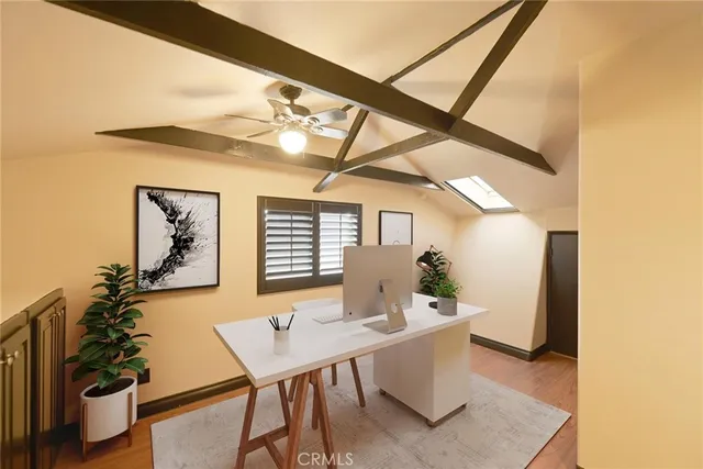 a workspace with furniture and window