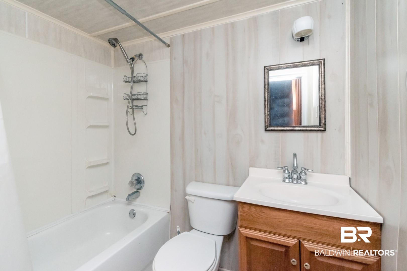 20 Kirby Street Mobile, AL 36607 - Photo 23 of 35 Full bathroom with toilet, vanity, and washtub / shower combination