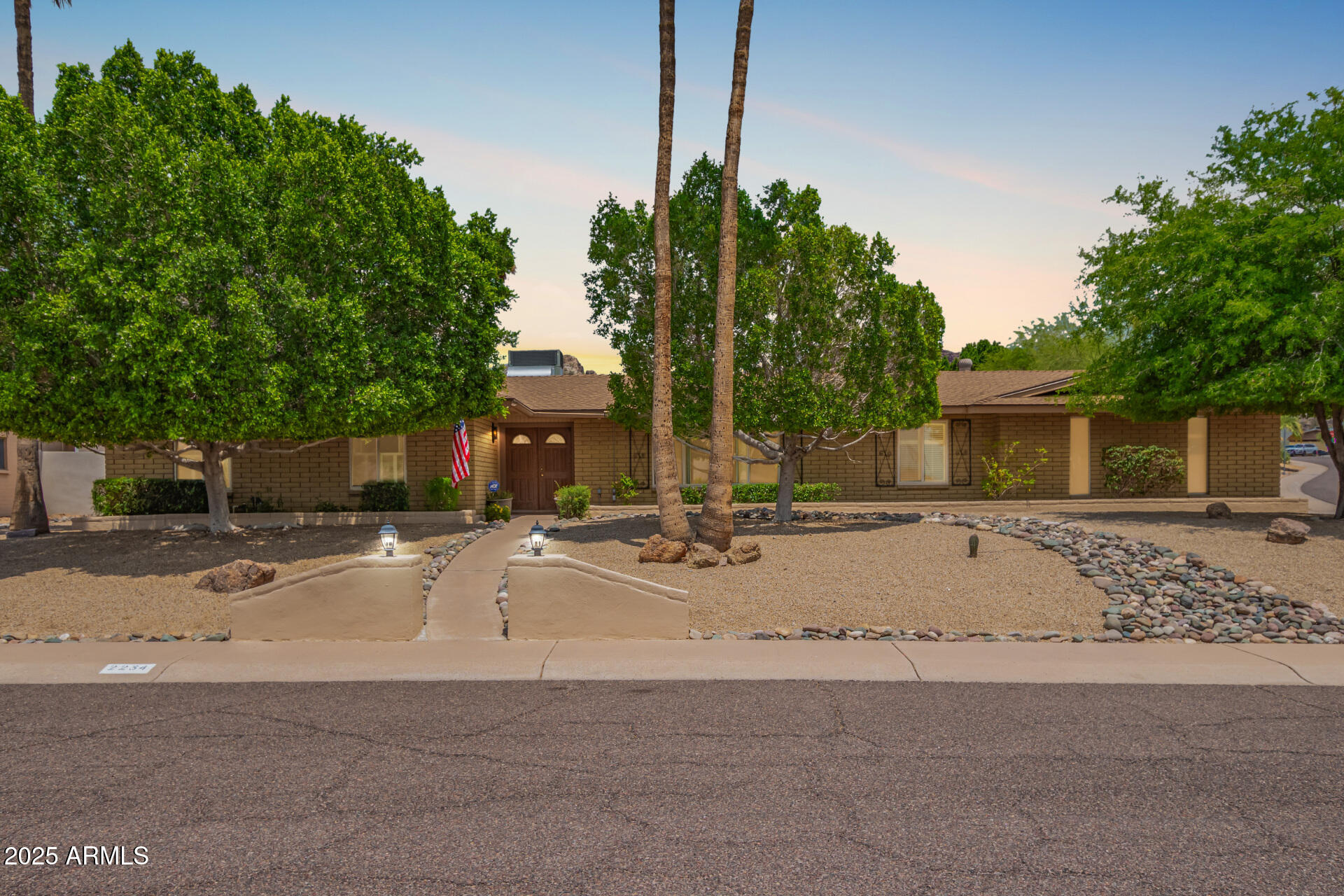 a view of a house with outdoor space and parking