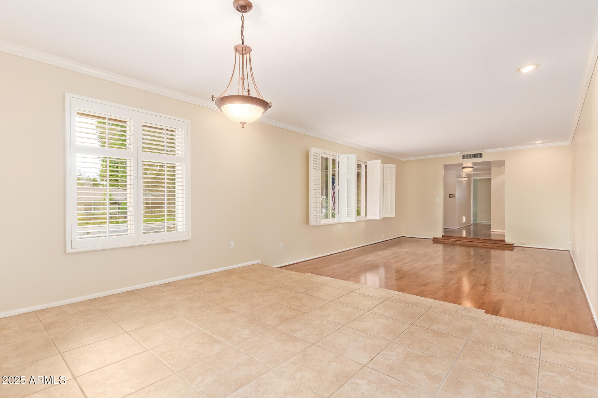 2234 East Lawrence Road Phoenix, AZ 85016 - Photo 10 of 71 a view of empty room with wooden floor and windows