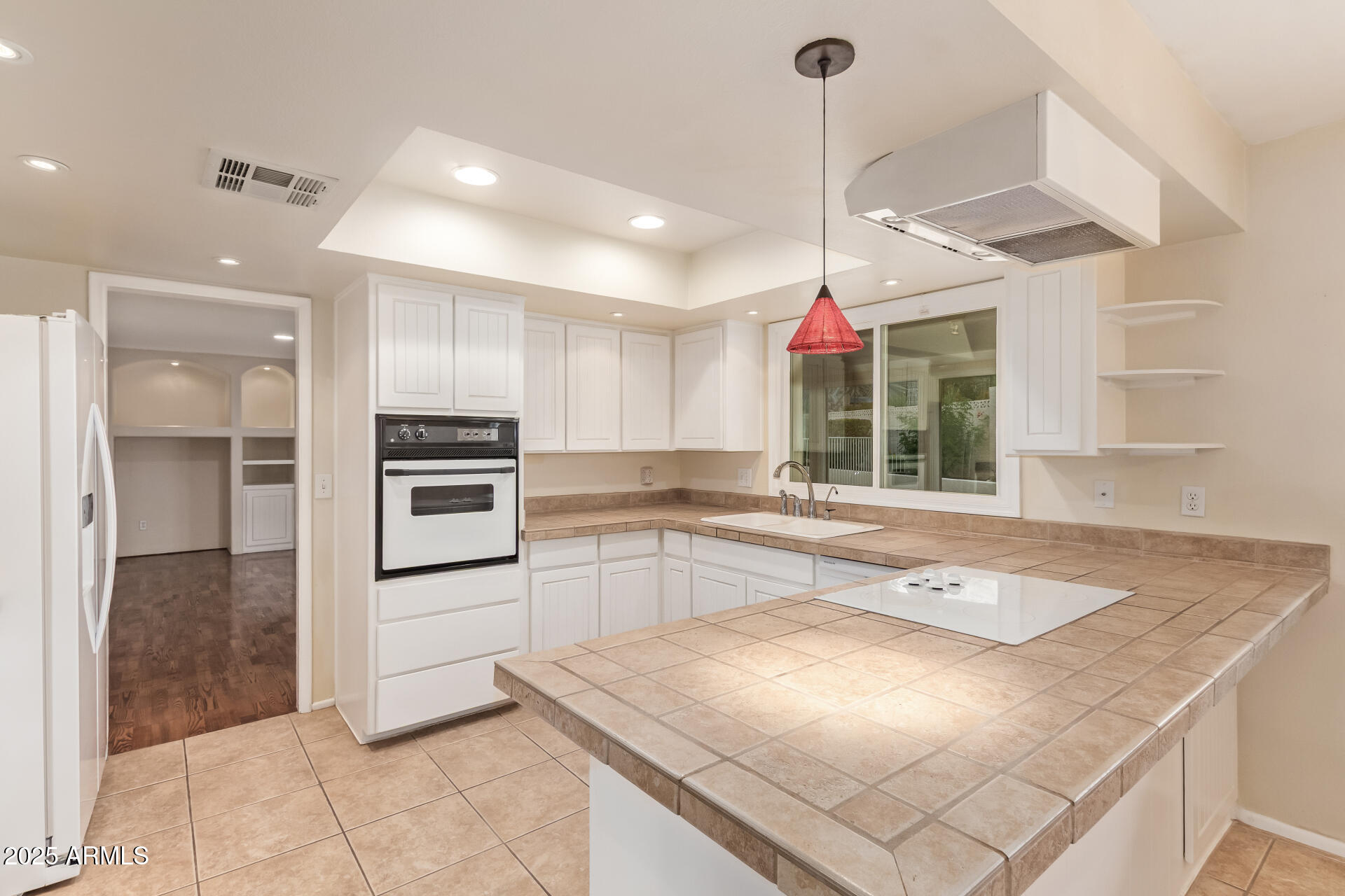 2234 East Lawrence Road Phoenix, AZ 85016 - Photo 14 of 71 a kitchen with a sink a counter top space appliances and cabinets