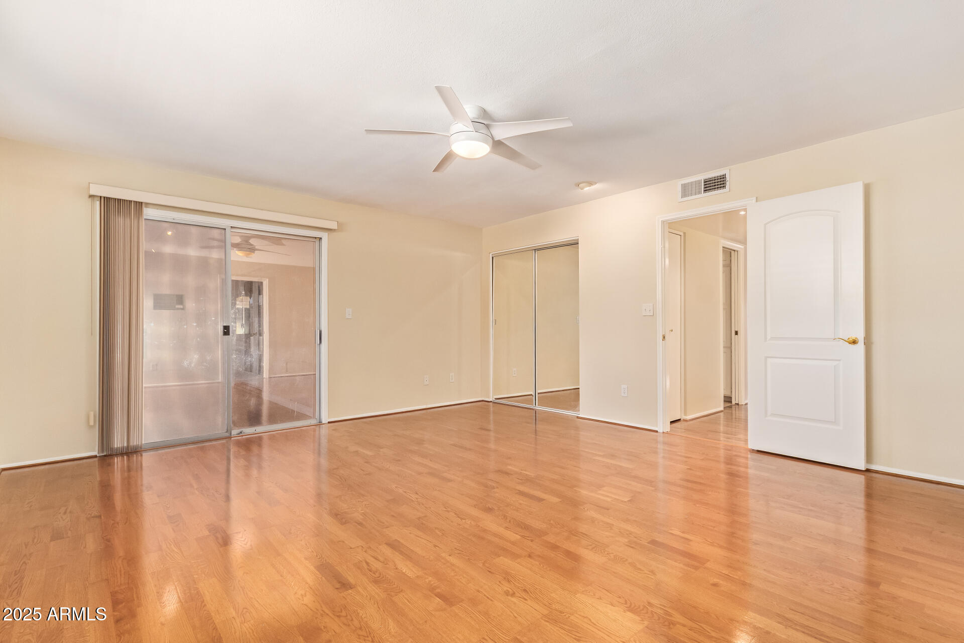 2234 East Lawrence Road Phoenix, AZ 85016 - Photo 24 of 71 a view of an empty room with wooden floor
