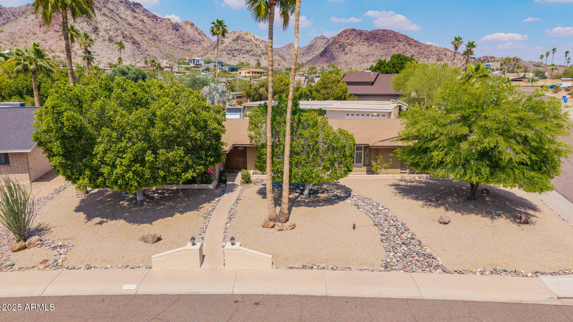 2234 East Lawrence Road Phoenix, AZ 85016 - Photo 2 of 71 a view of a house with a yard and sitting area
