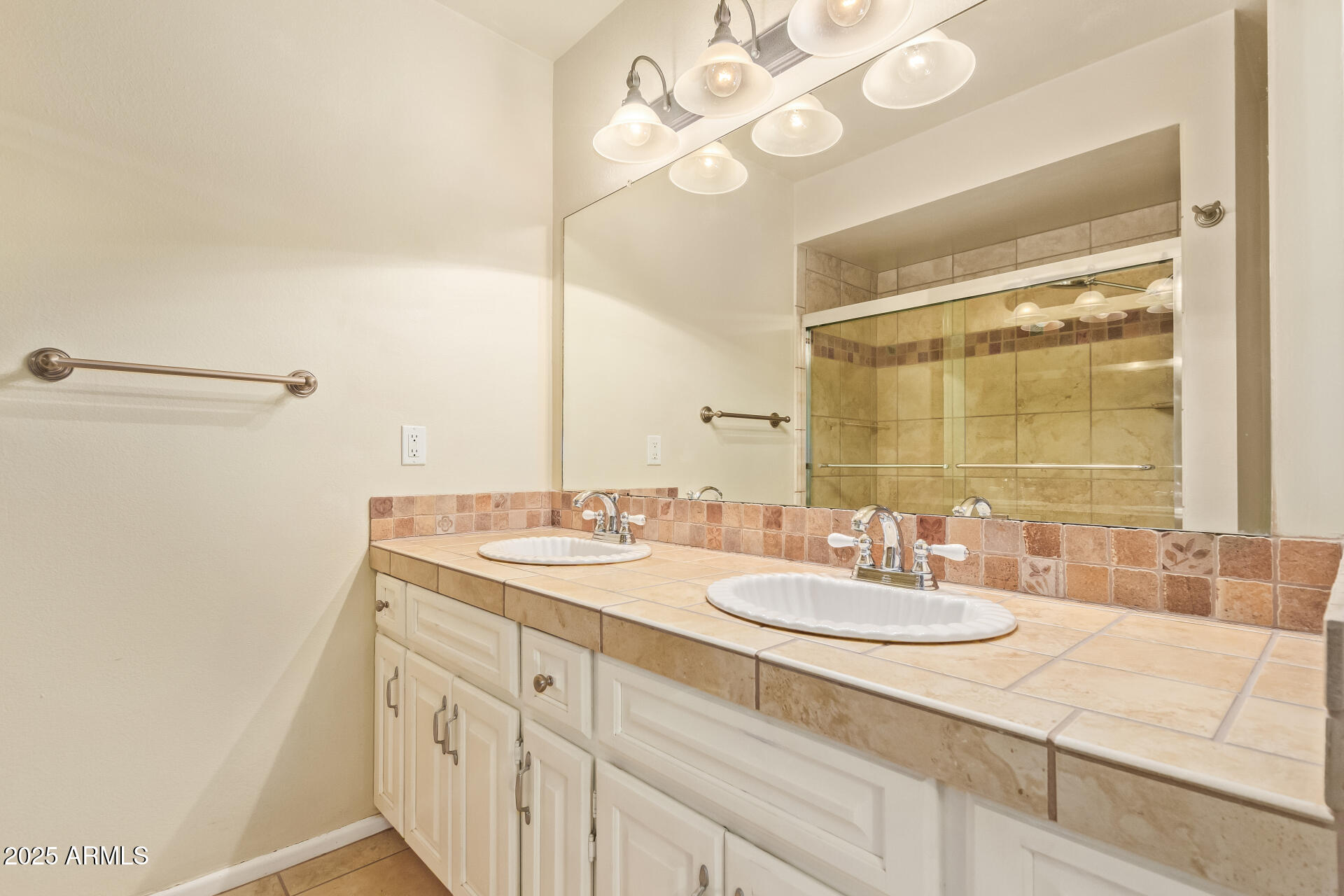 2234 East Lawrence Road Phoenix, AZ 85016 - Photo 31 of 71 a bathroom with a sink and a mirror