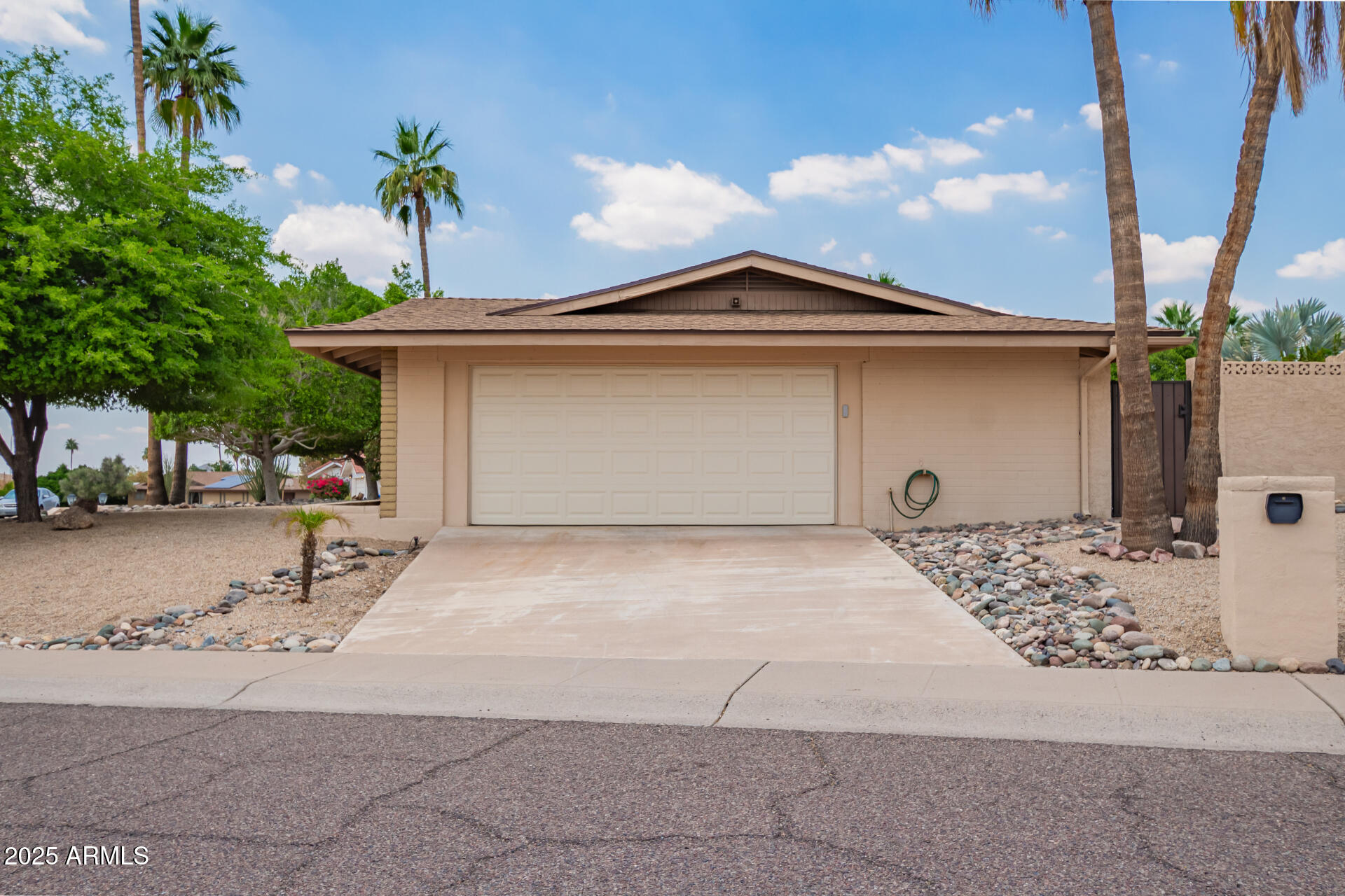 2234 East Lawrence Road Phoenix, AZ 85016 - Photo 44 of 71 a front view of a house with a yard and garage