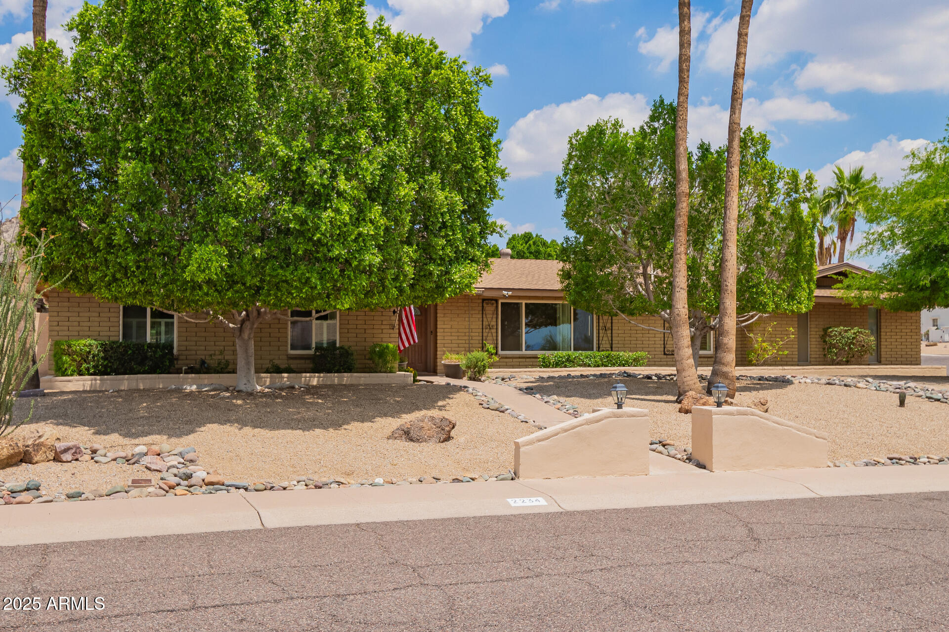 2234 East Lawrence Road Phoenix, AZ 85016 - Photo 3 of 71 a white house that has a tree in front of it