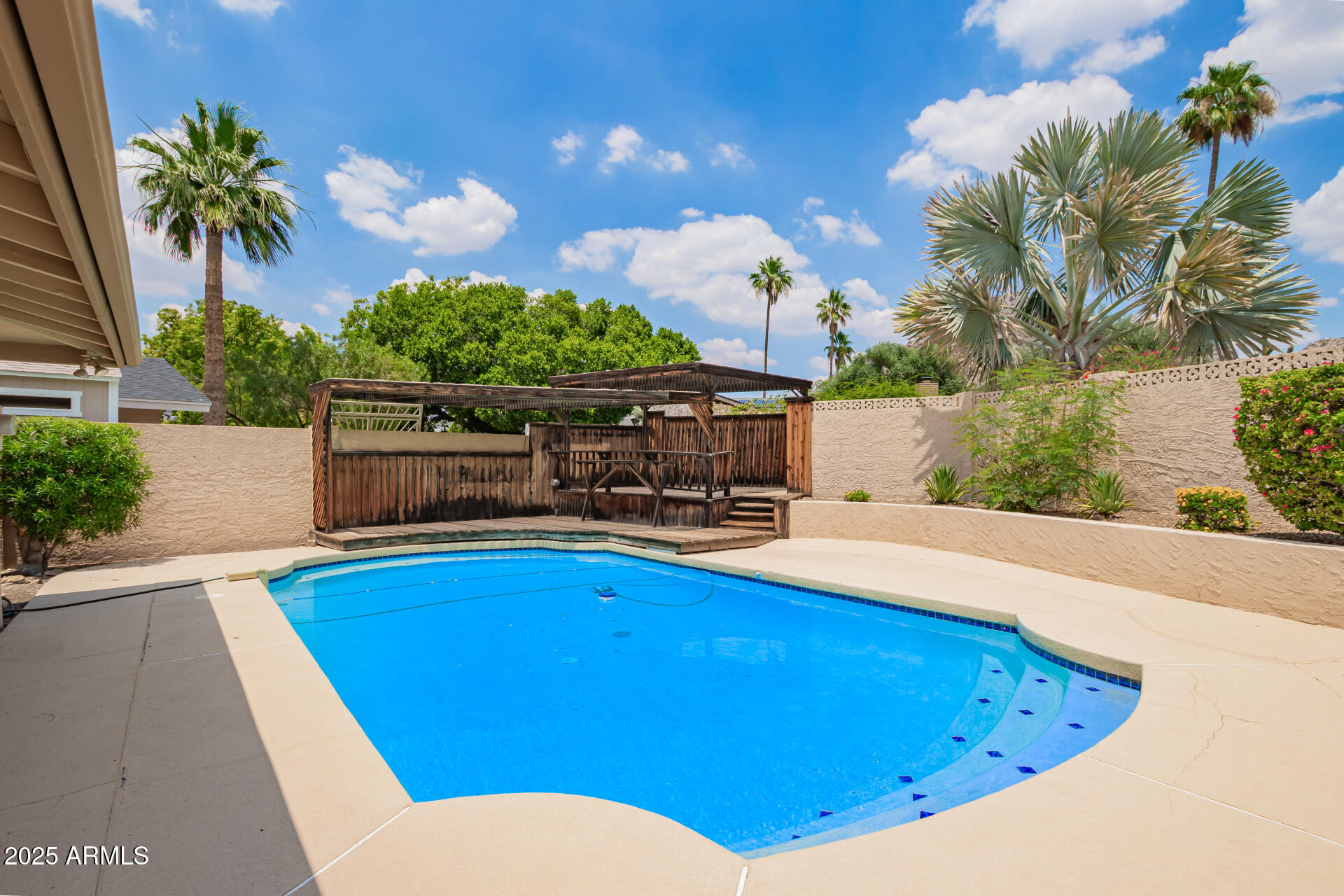 2234 East Lawrence Road Phoenix, AZ 85016 - Photo 51 of 71 a view of a swimming pool with a patio