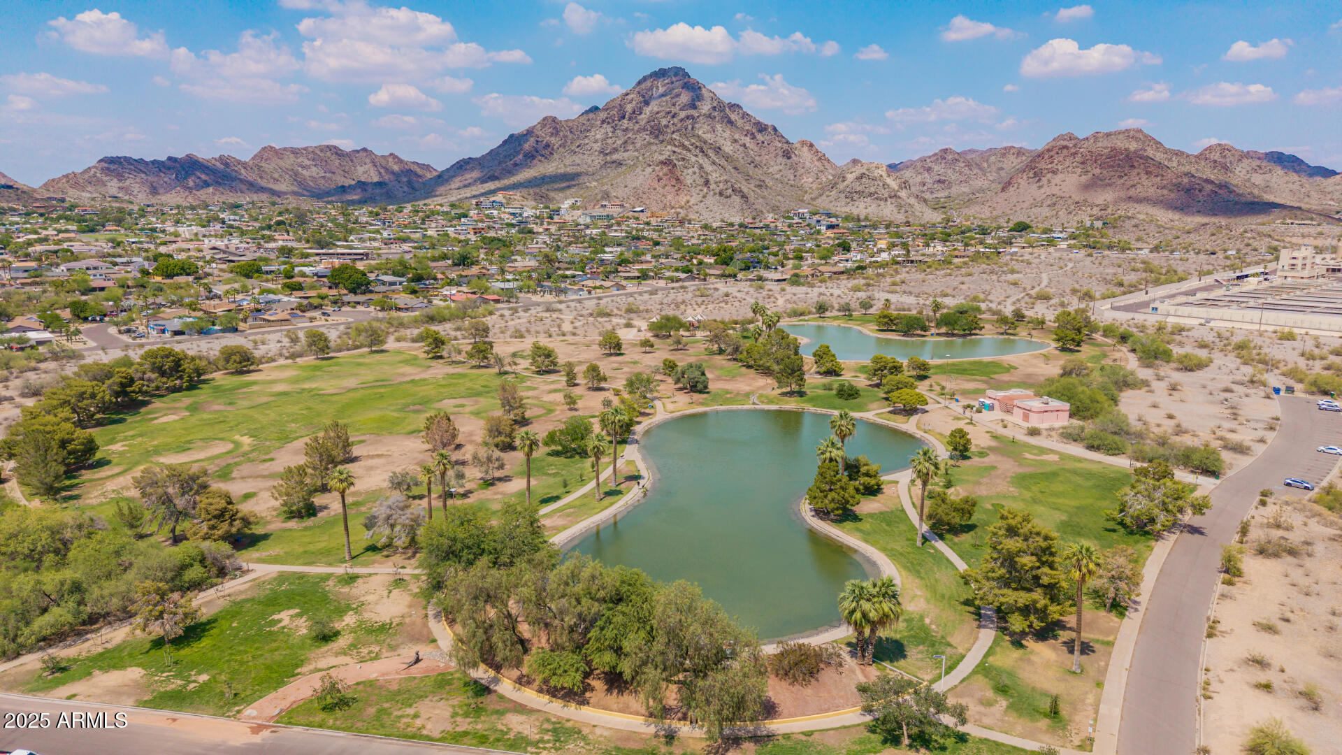 2234 East Lawrence Road Phoenix, AZ 85016 - Photo 67 of 71 a view of a lake with a mountain in the background