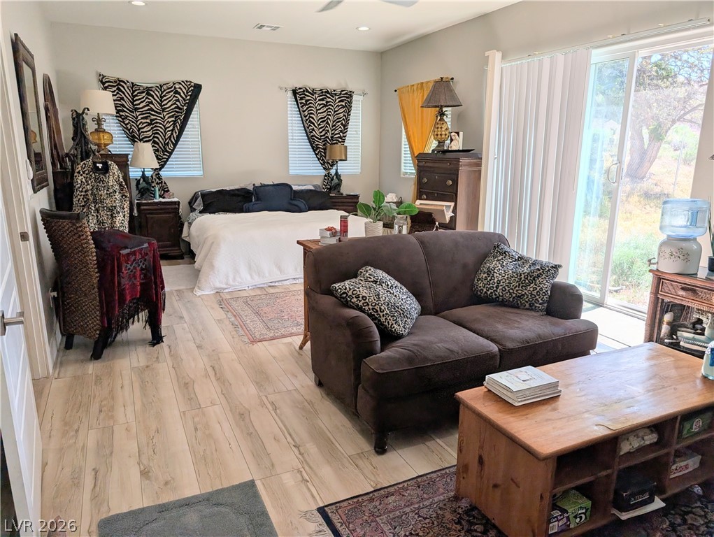 251 Spring Heights Caliente, NV 89008 - Photo 15 of 27 This bright bedroom features a comfortable living area, creating a versatile and inviting personal retreat.