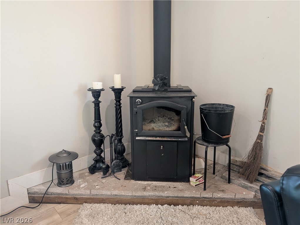 251 Spring Heights Caliente, NV 89008 - Photo 7 of 27 This living space features a cozy corner fireplace, perfect for relaxation.