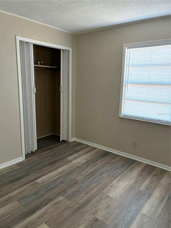 470 Southwest Dove Street Keystone Heights, FL 32656 - Photo 12 of 20 an empty room with closet and windows
