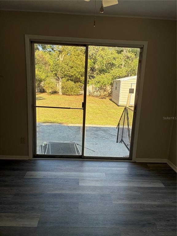 470 Southwest Dove Street Keystone Heights, FL 32656 - Photo 15 of 20 a view of an empty room with wooden floor and a window