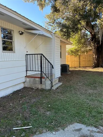 a view of small pool with a yard