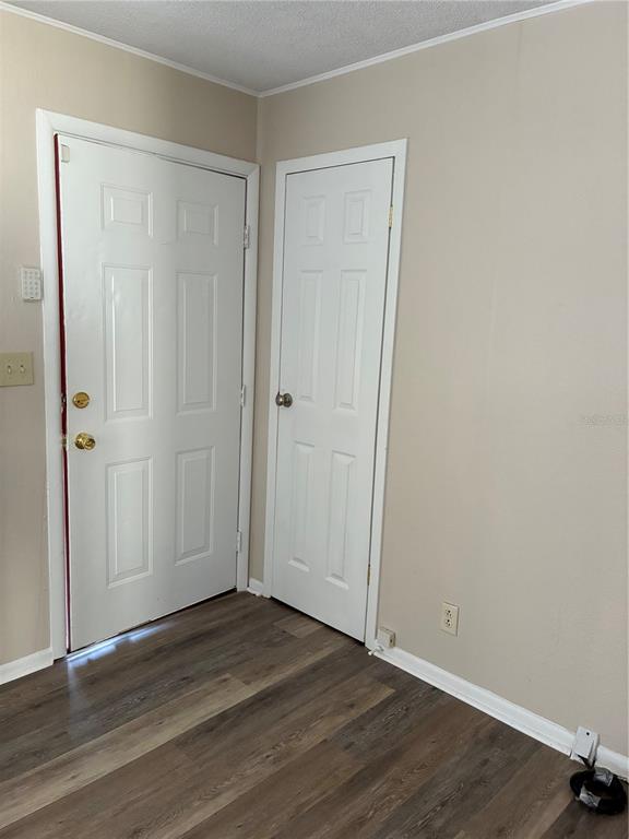 470 Southwest Dove Street Keystone Heights, FL 32656 - Photo 2 of 20 a view of an empty room with wooden floor