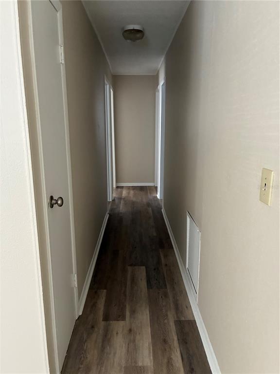 470 Southwest Dove Street Keystone Heights, FL 32656 - Photo 5 of 20 a view of a hallway with wooden floor