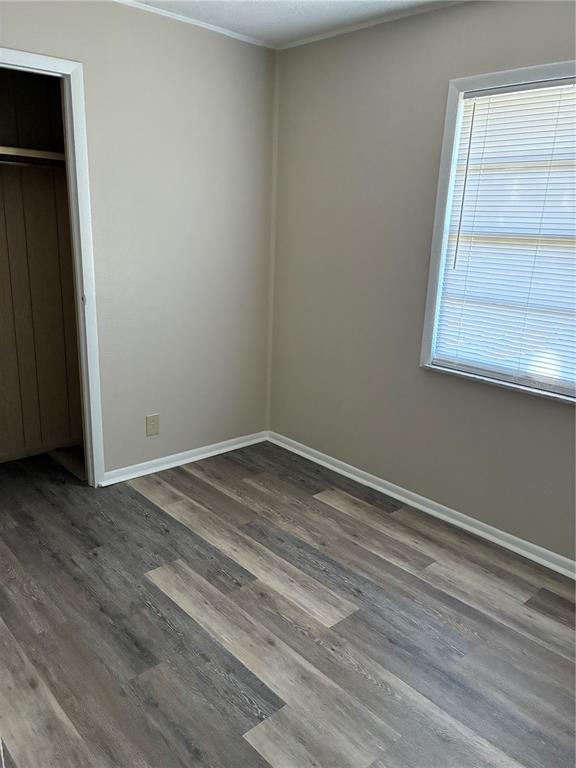 470 Southwest Dove Street Keystone Heights, FL 32656 - Photo 9 of 20 a view of empty room with wooden floor and fan