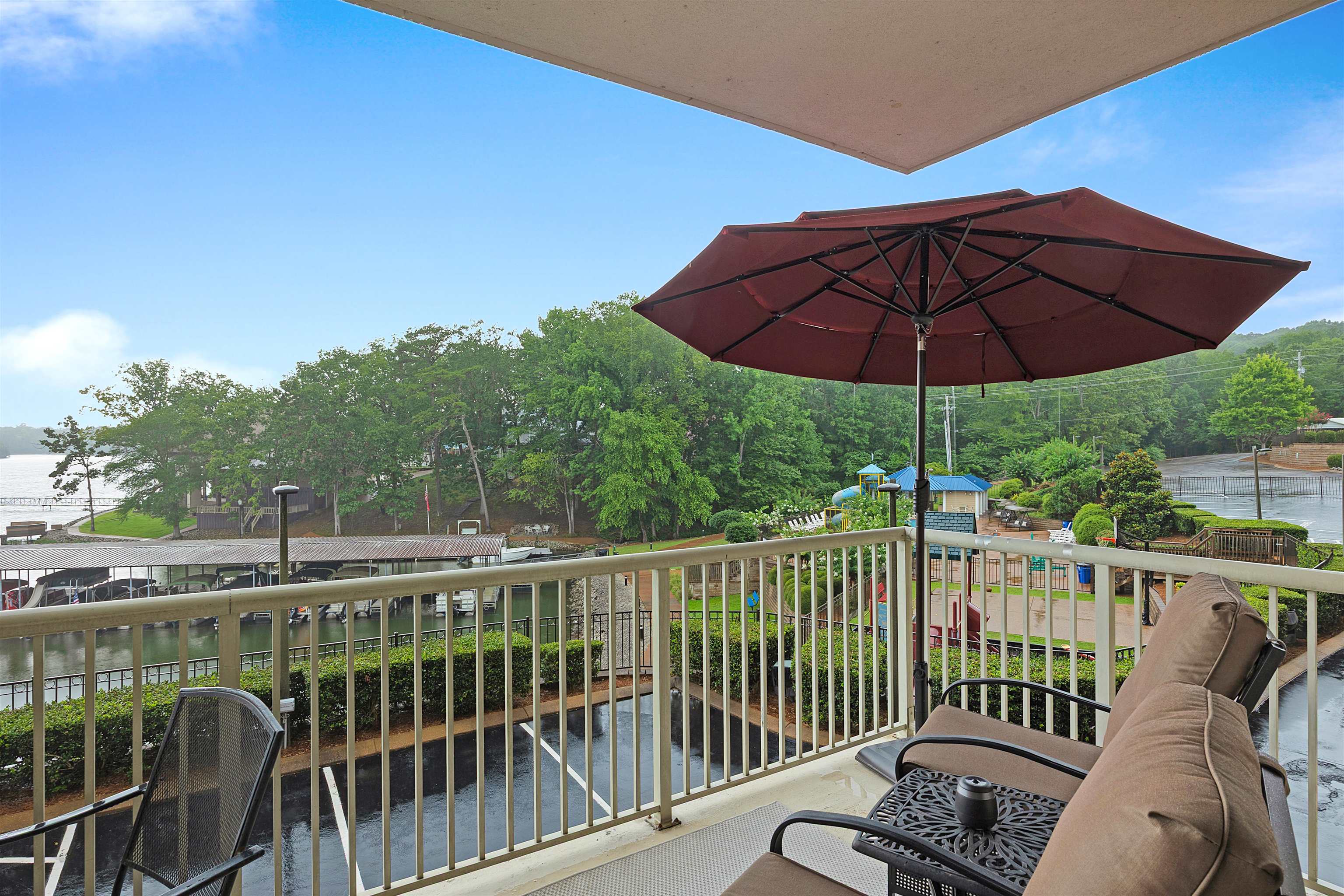25 Cr 380 Road, Unit P 204 Iuka, MS 38852 - Photo 15 of 19 a view of a balcony with furniture and umbrella