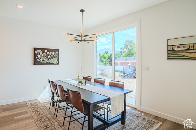 342 Perrine Drive Midvale, UT 84047 - Photo 7 of 37 Recessed ceiling lighting, modern chandelier, wood-finish flooring, sliding glass door, white trim