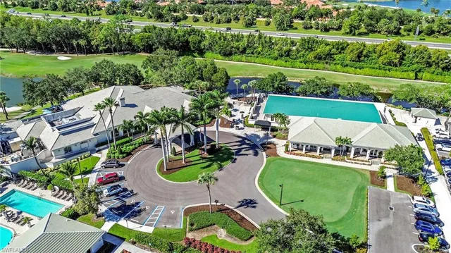 an aerial view of a house with outdoor space and lake view