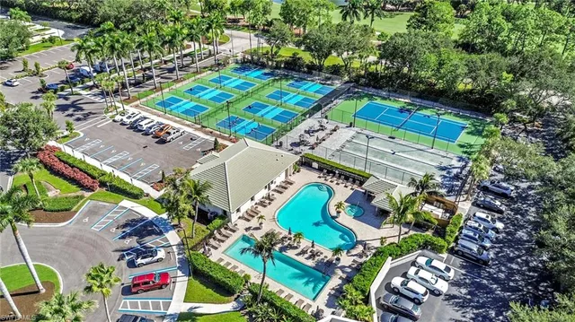 a view of a room with a furniture wooden floor and a floor to ceiling window