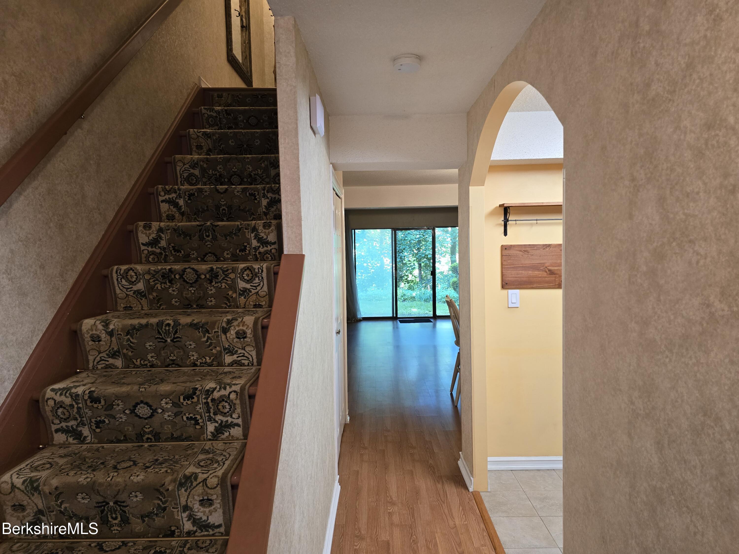 555 Russell Road, Unit J 65 Westfield, MA 01085 - Photo 2 of 20 a view of a hallway with wooden floor and entryway