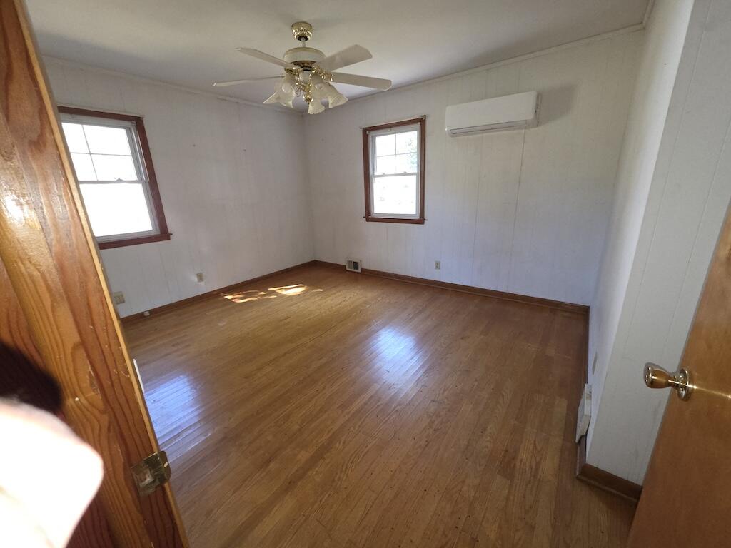 540 Bernard Road Rocky Mount, VA 24151 - Photo 14 of 23 wooden floor in an empty room with a window