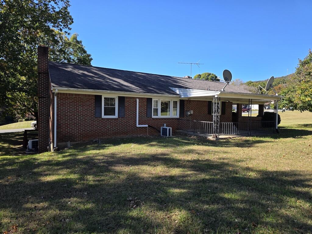540 Bernard Road Rocky Mount, VA 24151 - Photo 7 of 23 a backyard of a house with yard table and chairs