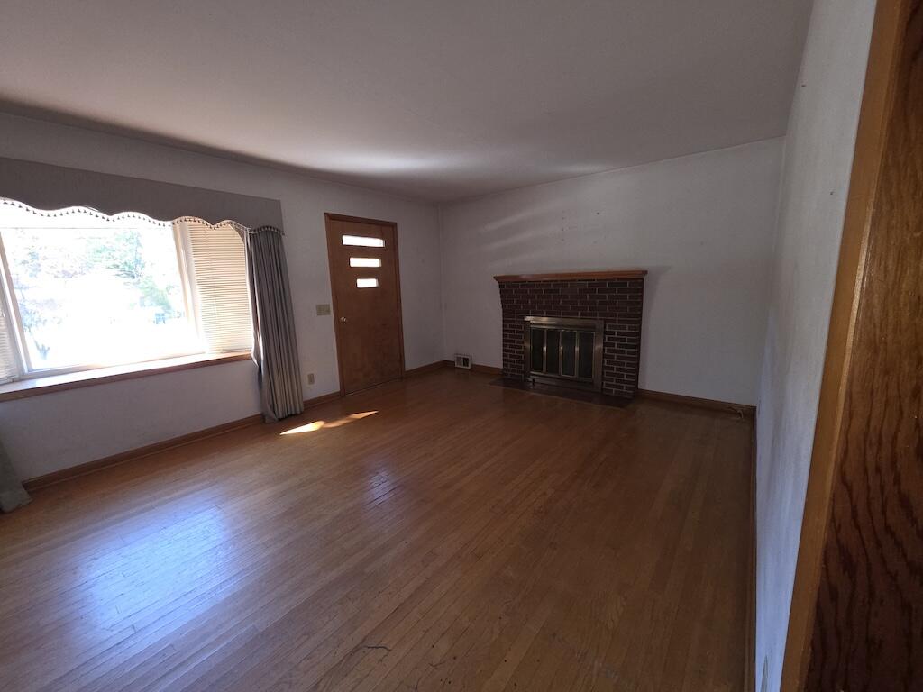 540 Bernard Road Rocky Mount, VA 24151 - Photo 10 of 23 an empty room with wooden floor and windows