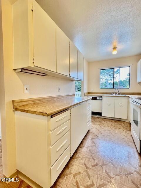 511 Cypress Street, Unit 4 Fort Bragg, CA 95437 - Photo 16 of 38 a kitchen with stainless steel appliances granite countertop a sink and cabinets