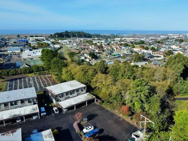 an aerial view of a house with a garden