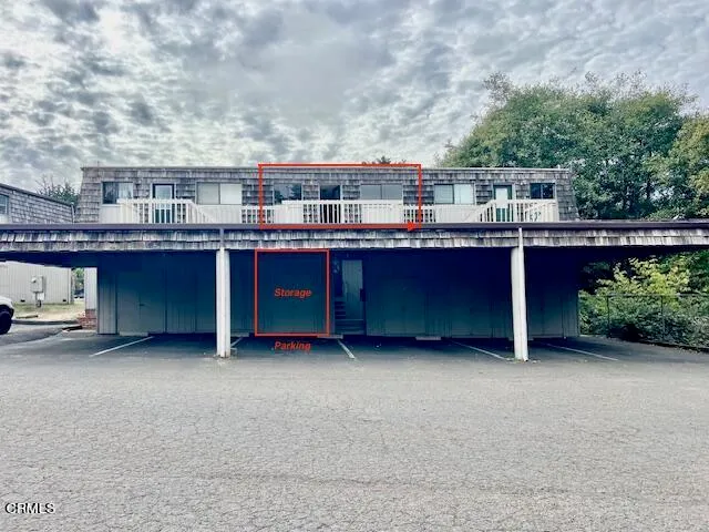 a balcony with a table and chairs