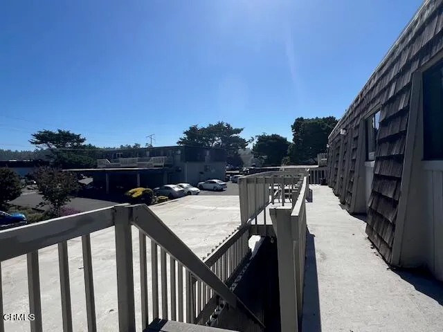 a view of a deck with sunset view