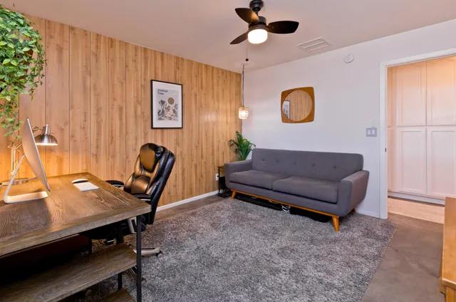 a outdoor dining space with furniture and wooden floor