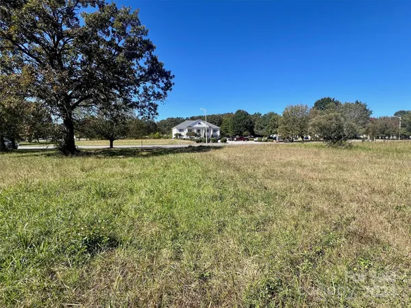 a view of a large yard with an outdoor space