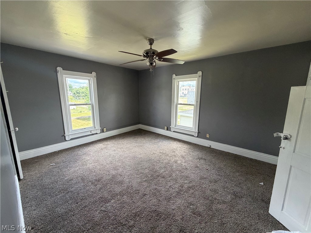 32 Cherry Road Northwest Massillon, OH 44646 - Photo 9 of 12 Second Bedroom with ceiling fan, carpet and widows for plenty of natural lighting!
