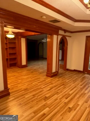 a view of a room with wooden floor and closet