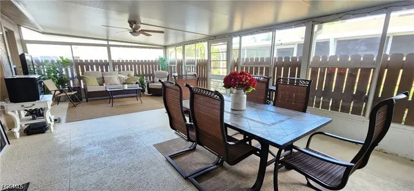 a view of a dining room with furniture window and outside view