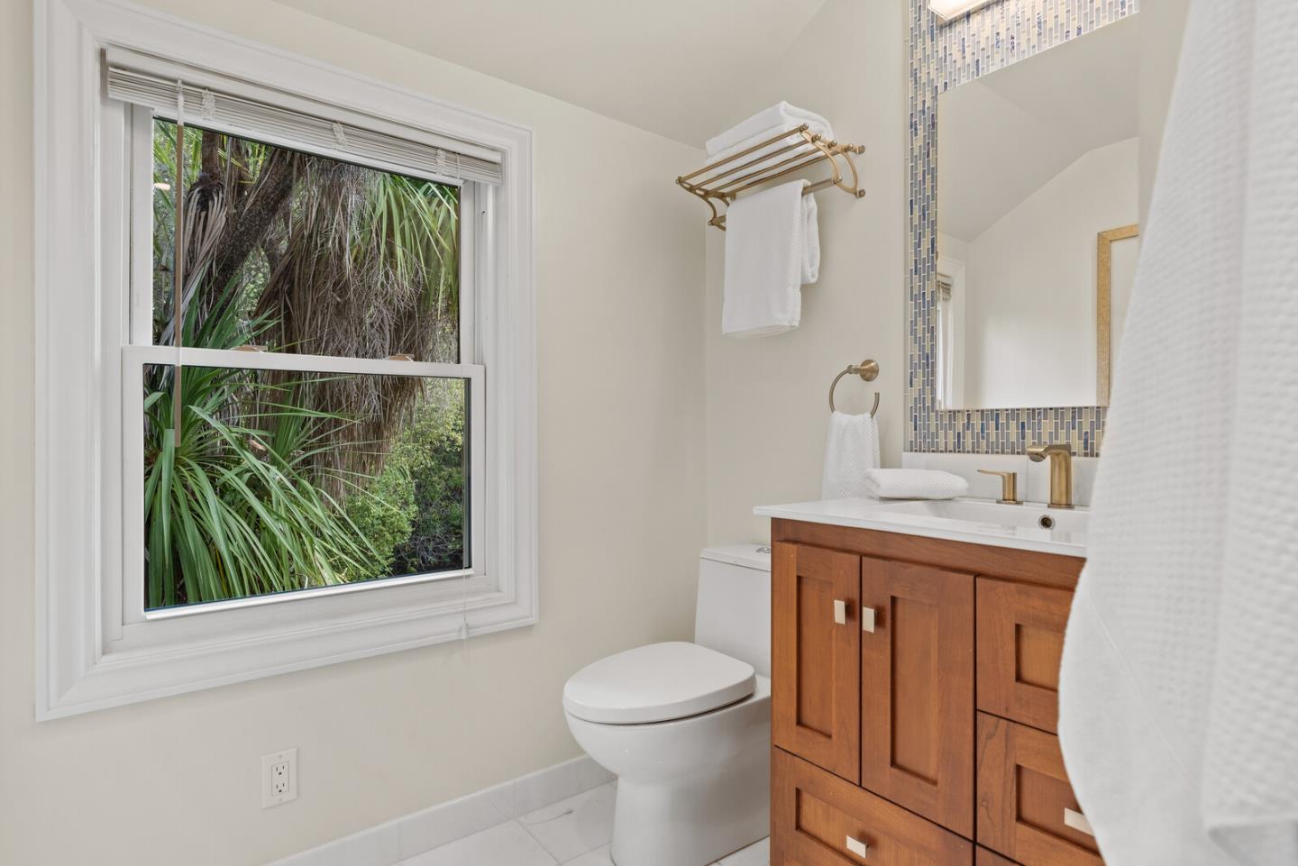 750 Edgewood Road San Mateo, CA 94402 - Photo 19 of 26 a bathroom with a toilet sink vanity and mirror