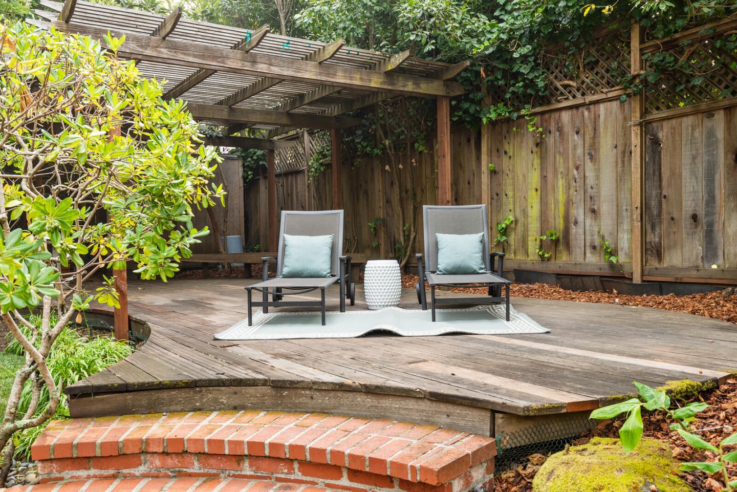 750 Edgewood Road San Mateo, CA 94402 - Photo 22 of 26 a view of backyard with chairs and a potted plant