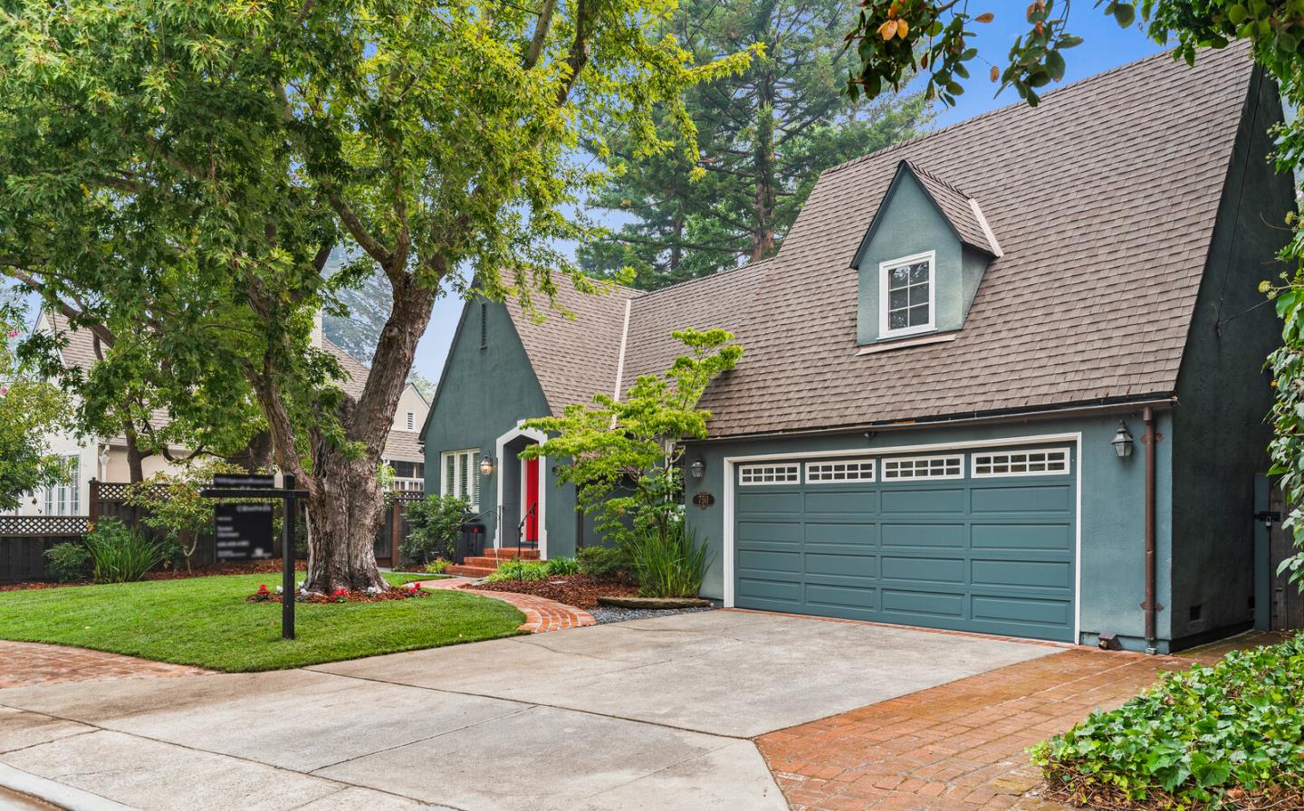 750 Edgewood Road San Mateo, CA 94402 - Photo 26 of 26 a front view of a house with a yard and garage