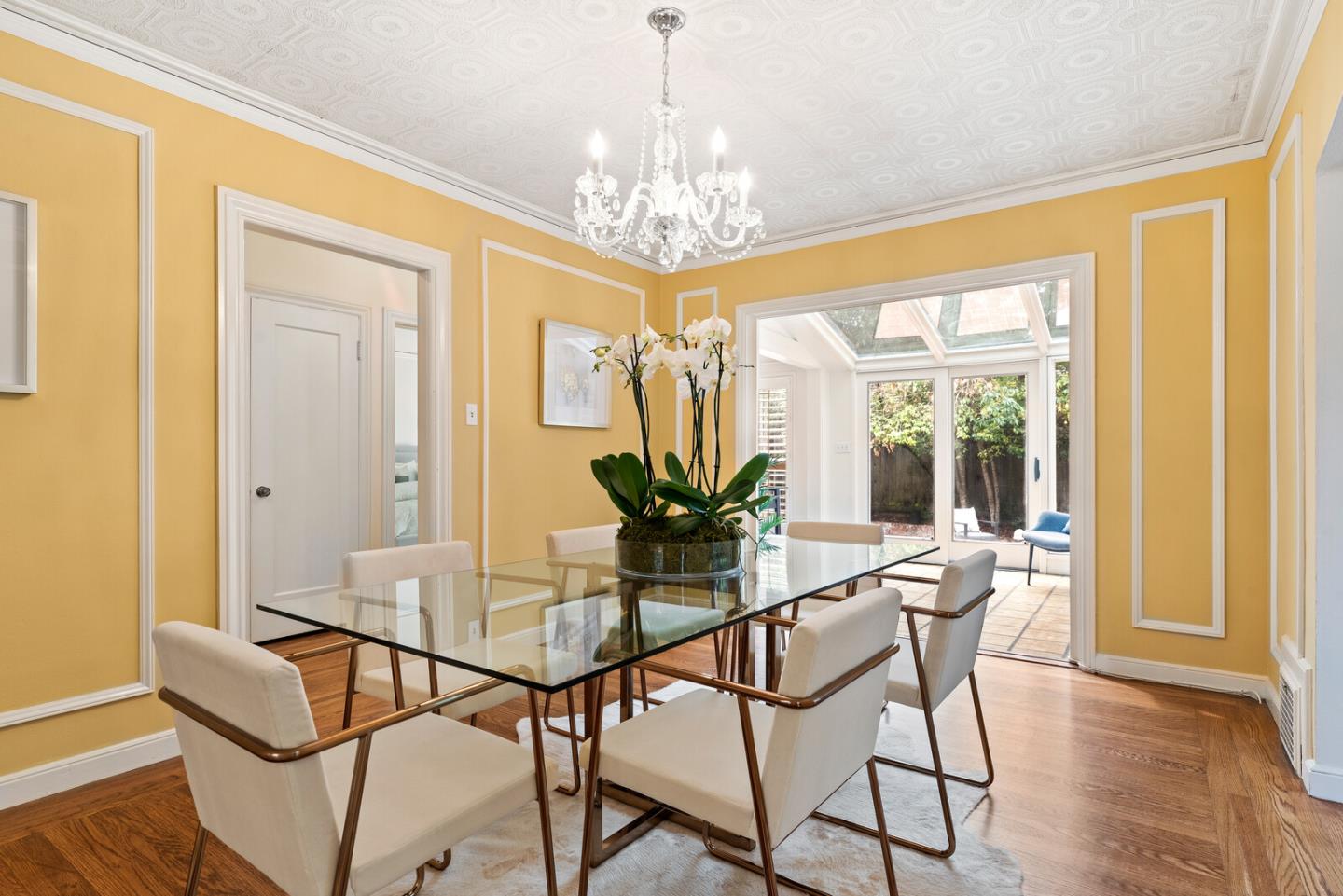 750 Edgewood Road San Mateo, CA 94402 - Photo 5 of 26 a dining room with furniture a chandelier and wooden floor