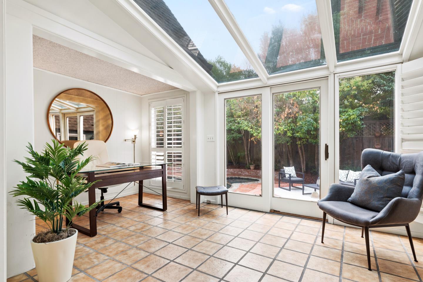 750 Edgewood Road San Mateo, CA 94402 - Photo 7 of 26 a living room with furniture and a potted plant