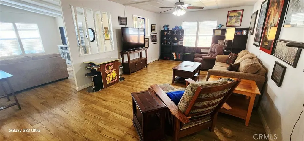 8651 Foothill, Unit 159 Rancho Cucamonga, CA 91730 - Photo 11 of 18 a living room with furniture and a flat screen tv