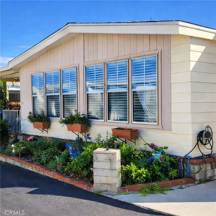 8651 Foothill, Unit 159 Rancho Cucamonga, CA 91730 - Photo 17 of 18 a front view of a house with garden