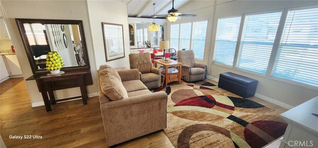 8651 Foothill, Unit 159 Rancho Cucamonga, CA 91730 - Photo 3 of 18 a living room with furniture and large windows
