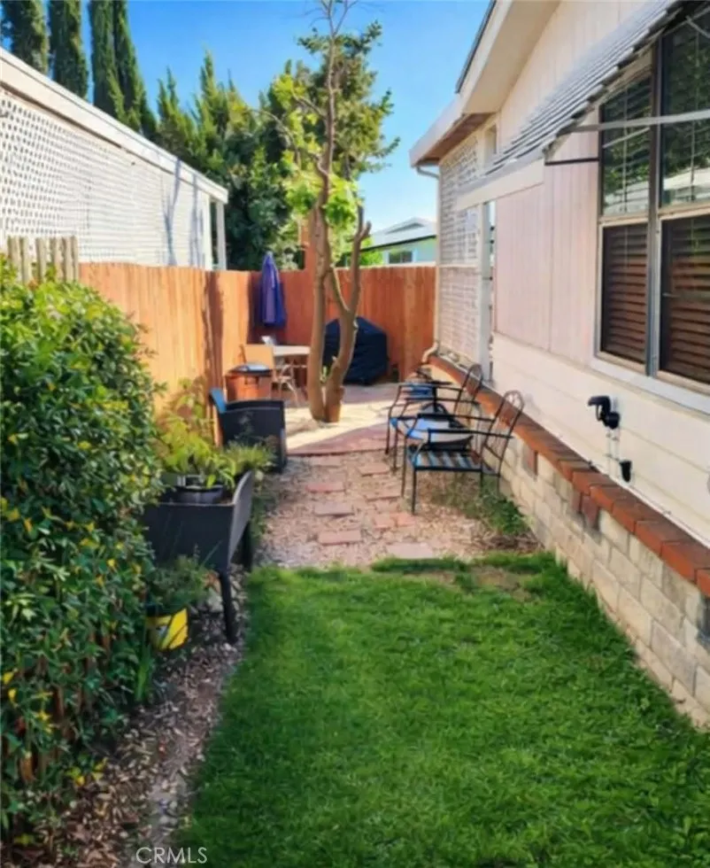8651 Foothill, Unit 159 Rancho Cucamonga, CA 91730 - Photo 4 of 18 a backyard of a house with outdoor seating