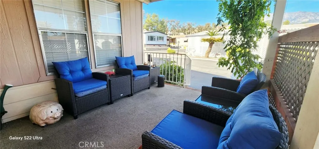 8651 Foothill, Unit 159 Rancho Cucamonga, CA 91730 - Photo 5 of 18 a living room with furniture and a floor to ceiling window