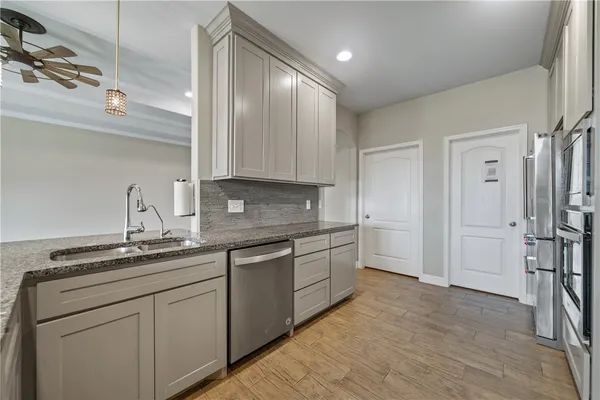 a kitchen with a sink and cabinets