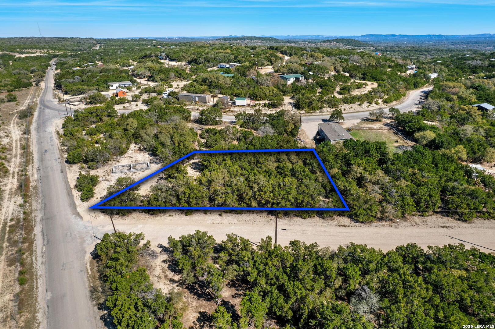 Tbd Bandera Lakeshore Bandera, TX 78003 - Photo 6 of 8 an aerial view of a house with a yard