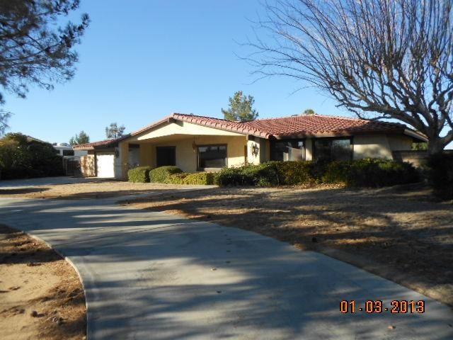13298 Rincon Road Apple Valley, CA 92308 - Photo 1 of 1 Circular drive, tile roof and mature trees.